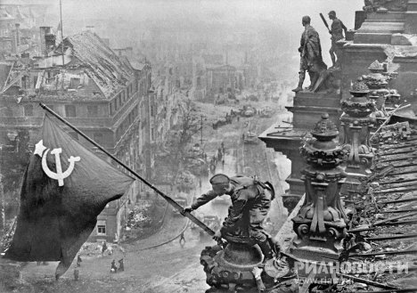 On April 30, 1945, Soviet soldiers raised the red Victory Banner over the Reichstag building in Berlin.